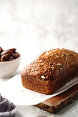Fototapeta na wymiar Homemade healthy date nut bread loaf, selective focus