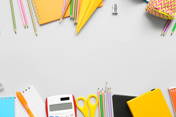 Paper plane and different school stationery on white background