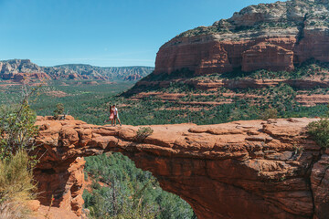 Travel in Devil's Bridge Trail, scenic view panoramic landscape in Sedona, Arizona, USA. Happy Couple on the famous trail in Sedona