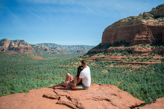 Travel in Devil's Bridge Trail, scenic view panoramic landscape in Sedona, Arizona, USA. Happy Couple on the famous trail in Sedona