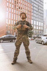 Portrait of Ukrainian soldier in uniform on the street