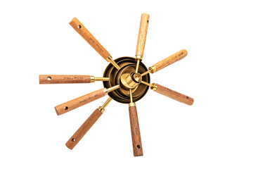 Various Copper Measuring Cups with Wooden Handle on a White Background