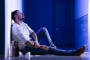 Male drug addict sitting in hall