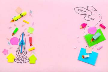 Creative composition with drawn rockets and different stationery on pink background