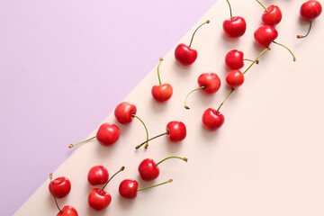 Obraz na płótnie Canvas Many sweet cherries on colorful background