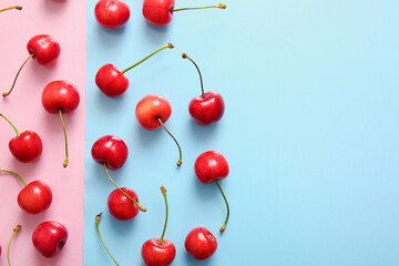 Obraz na płótnie Canvas Many sweet cherries on colorful background