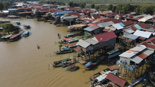 Floating village on a river, Kampong Phluk, Cambodia, Boats, fisherman, 4k Drone footage