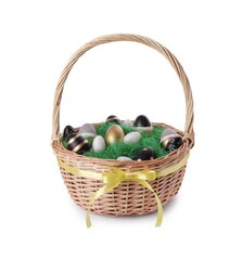 Wicker basket with beautifully painted Easter eggs isolated on white