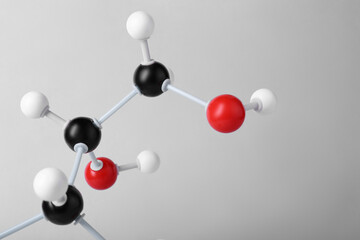 Molecule of glucose on light grey background, closeup. Chemical model