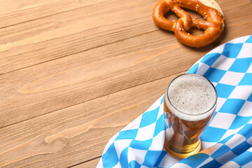 Flag of Bavaria, mug with beer and pretzel on wooden background