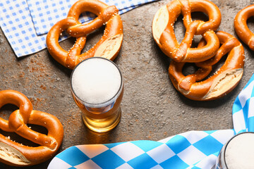 Flag of Bavaria, mug with beer and pretzels on dark background