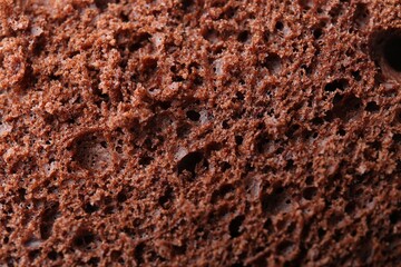 Tasty chocolate sponge cake as background, closeup