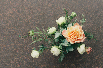 bouquet of roses on a wooden table.
Generative AI