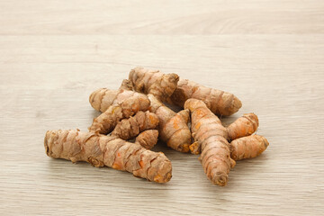 Turmeric, Curcuma or Kunyit on wooden table
