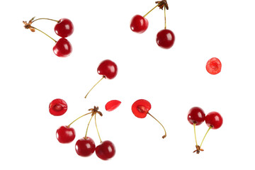 Obraz na płótnie Canvas Flying red sweet cherries on white background