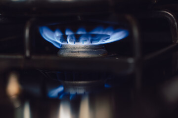 close up of the blue flames on a gas burning range or stove