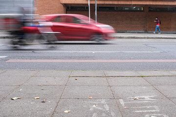 Blazing Speed: Cars Zooming Down the Street