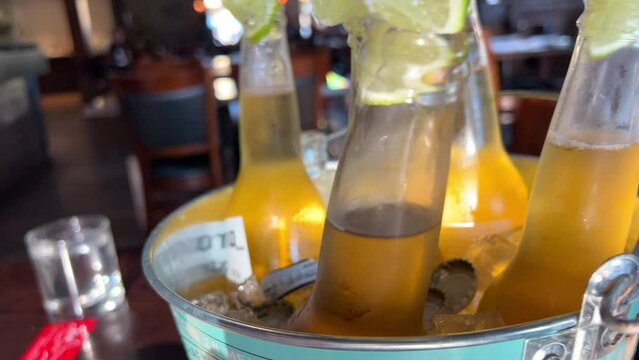 Glass Of Refreshing Ice Cold Cider With Lime Outside Close Up. High quality 4k footage