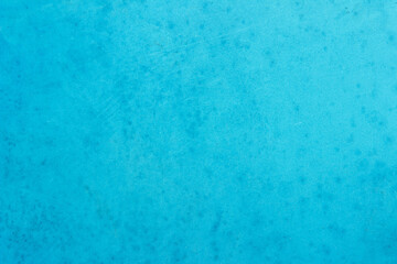 Blue concrete stone texture for background in summer wallpaper. Cement and sand wall of tone vintage. Concrete abstract wall of light cyan color.