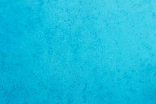 Blue concrete stone texture for background in summer wallpaper. Cement and sand wall of tone vintage. Concrete abstract wall of light cyan color.