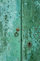 old rusty wood background green door