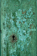 old rusty wood background green door