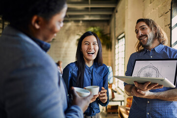 Young group of designers talking about the project in the office