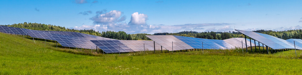 Countryside landscape with solar panels as green electricity energy production