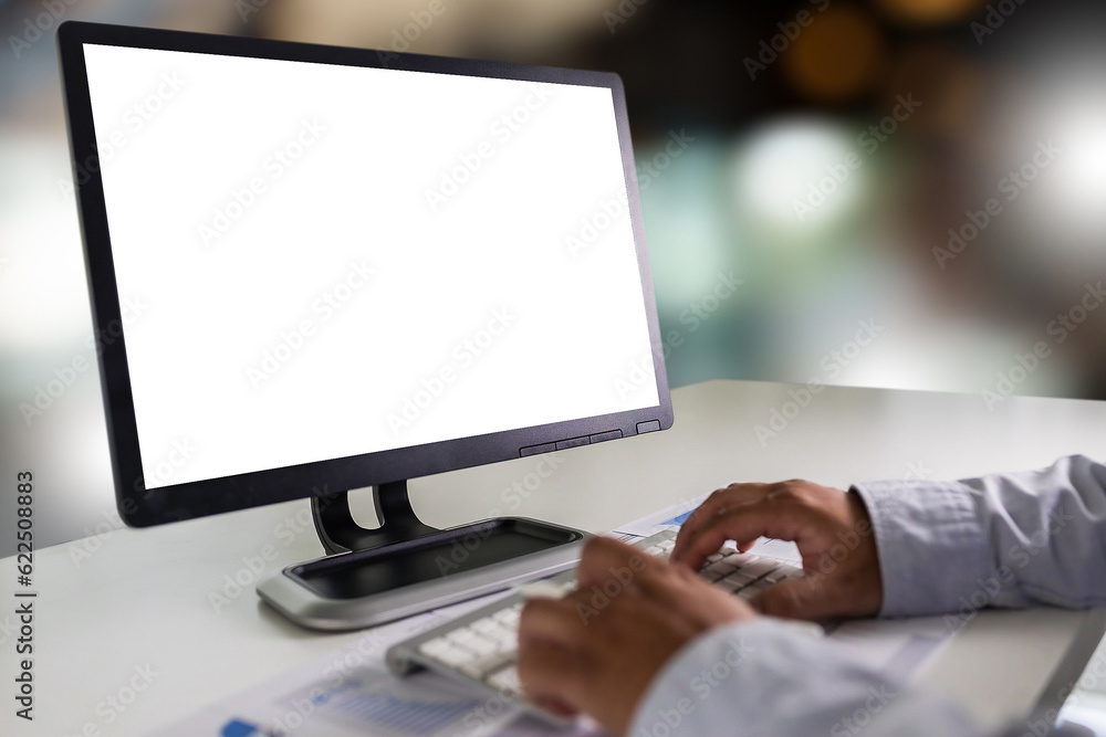 Poster a young businessman is working on the laptop using a desktop computer with a blank screen and an emp