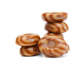 Caramel candies isolated on white background