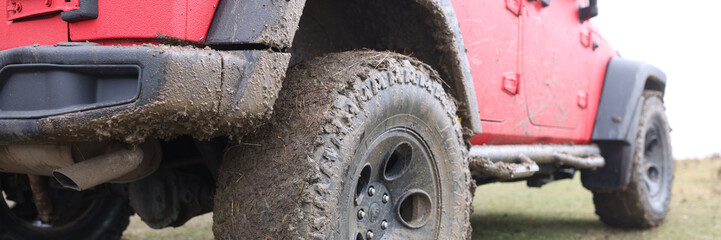 Offroad car concept with dirty road, wheel close-up.