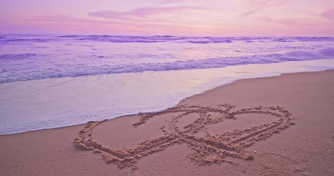 Heart symbol on beach, Hand drawn heart on beach sand over sunset or sunrise sky beautiful light nature landscape,Colorful sand sea background