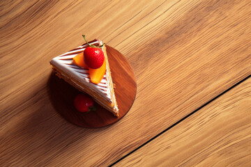 a piece of chocolate cake on a wooden table