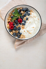 Healthy breakfast, cereal with berries and yogurt.