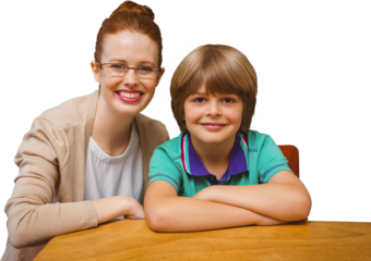 Digital png photo of caucasian female teacher and schoolboy at desk on transparent background