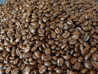 Roasted coffee beans stacked abstract background Aromatic bitter coffee that is popular to eat in the morning to feel refreshed. cure drowsiness.