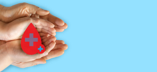 Hand holding red heart and blood drop donation, save life, world hemophilia day concept, world blood donor day, hospital, life and health insurance, world mental health day
