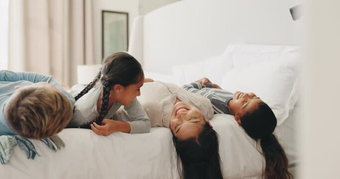 Relax, smile and morning with family in bedroom for wake up, support and playful. Happiness, peace and love with parents and children in bed at home for free time, conversation and bonding