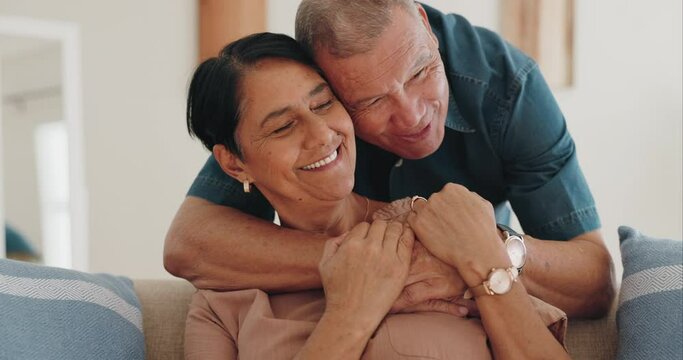 Love, home and happy elderly couple hug, smile and enjoy quality time together, bonding on surprise embrace. Living room sofa, marriage partner and senior people, old woman or man care for wife