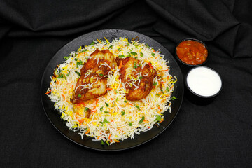 Fish biriyani on black background