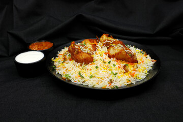 Fish biriyani on black background