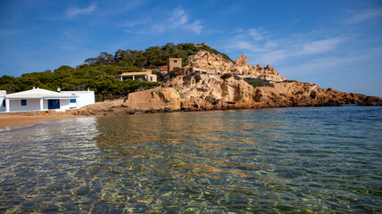 Cala Pregonda beach with golden sand on summer sunny day at Menorca island.