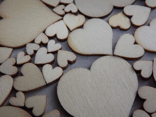 Obraz premium valentine's day greeting card-wooden hearts on a gray suede background. High quality photo