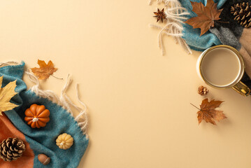 Capture essence of autumn from top view: coffee cup, warm scarf, small pumpkins, yellow maple...