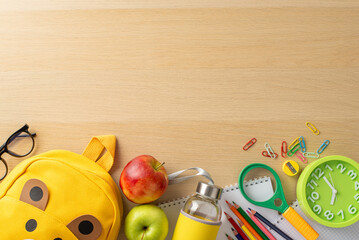 Preschool theme. Top view of vibrant materials, sketchbook, art kit, pencils, eyeglasses, clips,...