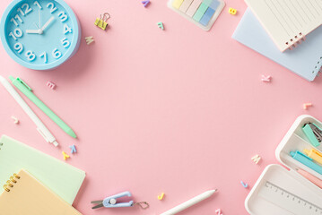 Brighten up your study routine! Top-down view of back-to-school essentials—copybooks, pens,...