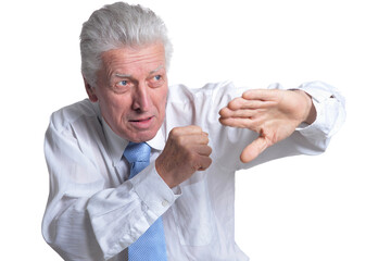 close up portrait of senior businessman in formal wear posing