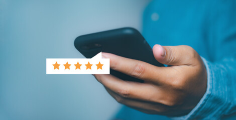 Businessman touching giving high score for feedback review satisfaction service. Customer satisfaction experience with five star icon and excellent for feedback review satisfaction service.