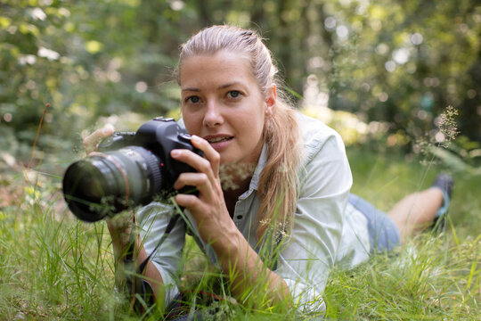 professional female photographer in nature