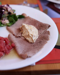 A delicious starter from Piedmont. Steak tartare, carpaccio, stuffed peppers, and salad